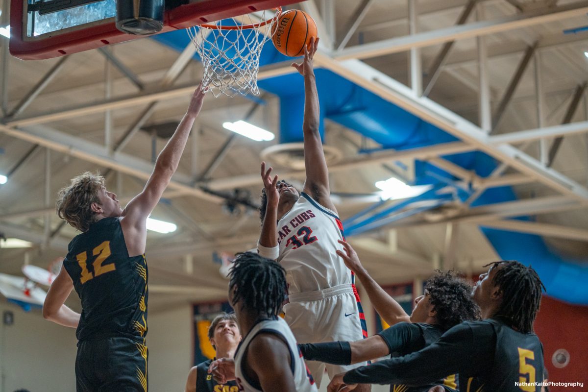 Santa Rosa’s forward Jaden Washington rises above three Sac City players for a lay-up against Sac City at Haehl Pavilion on Tuesday, Jan. 14, 2025.