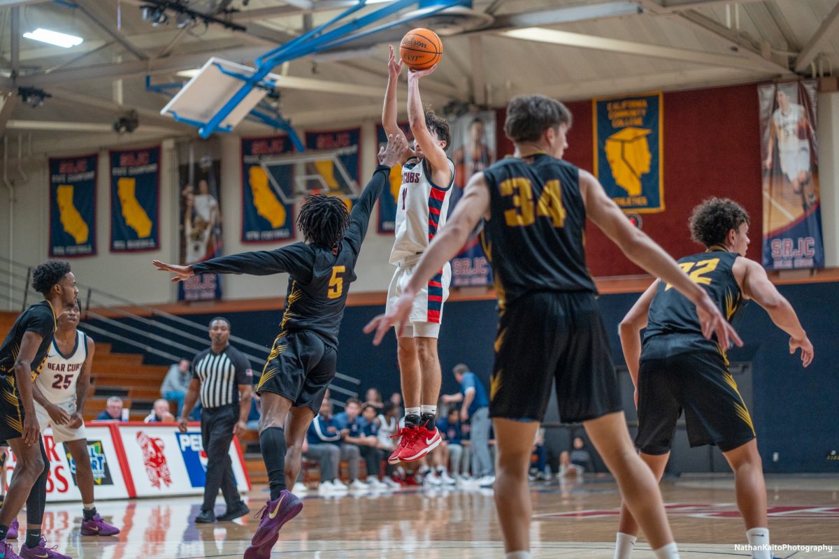 Bear Cubs’ guard Spencer Langowski steps back and shoots above Sac City’s guard Aaron Gillyard against Sac City at Haehl Pavilion on Tuesday, Jan. 14, 2025.