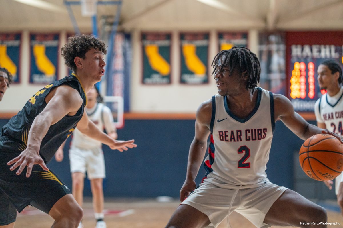 Santa Rosa’s guard Yanik Anderson looks for the next pass as he shields the ball in the paint against Sac City at Haehl Pavilion on Tuesday, Jan. 14, 2025.