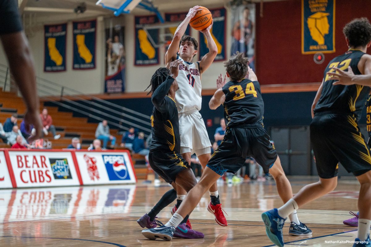 Bear Cubs’ guard Spencer Langowski rises above his two markers for a shot against Sac City at Haehl Pavilion on Tuesday, Jan. 14, 2025.