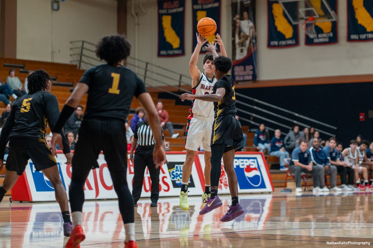 Santa Rosa’s guard Andrew Pengel pulls up from deep for a three-pointer as the Bear Cubs look to narrow Sac City’s advantage at Haehl Pavilion on Tuesday, Jan. 14, 2024.