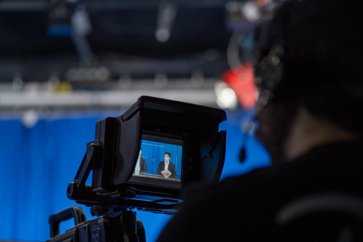 The student camera crew puts the election day coverage hosts in frame in the studio in Frank P. Doyle Library on Tuesday, Nov. 5, 2024.