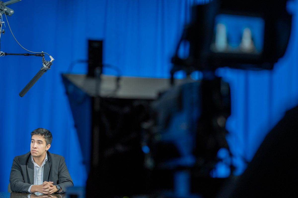 Election day coverage's host, and The Oak Leaf's Sal Sandoval-Garduno prepares to go live following a break in the studio in Frank P. Doyle Library on Tuesday, Nov. 5th, 2024.