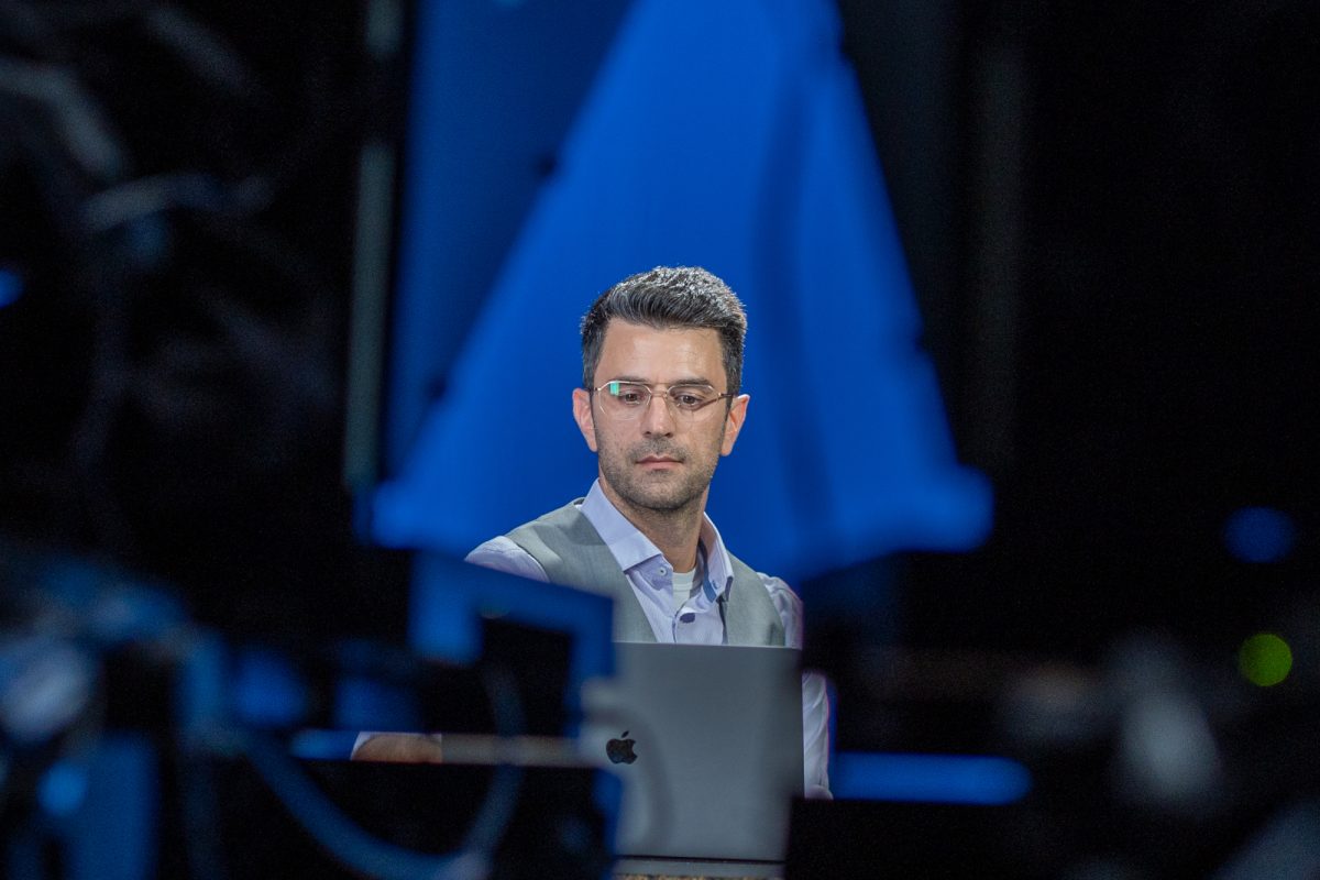 SRJC's communications professor Alexis Pulos reviews his notes before going live in the studio in Frank P. Doyle Library on Tuesday, Nov. 5, 2024.