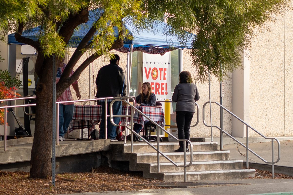 Voters check in at the front door at the Registrar of Voters in Santa Rosa on Tuesday, Nov. 5, 2024.