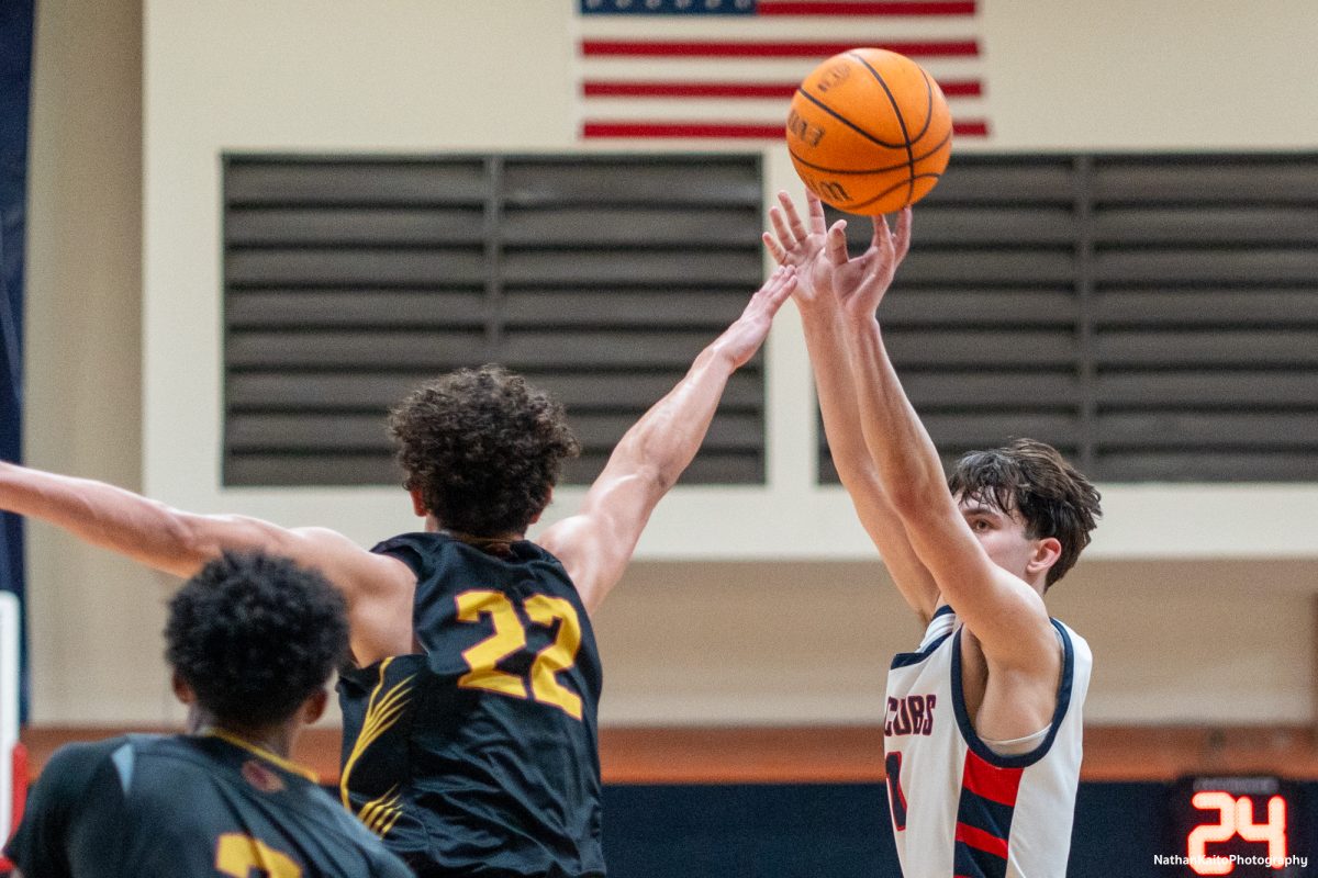 Santa Rosa’s guard rises above the Panther’s guard/forward Jayden Ferreira as he attempts a three-pointer against Sac City at Haehl Pavilion on Tuesday, Jan. 14, 2025.