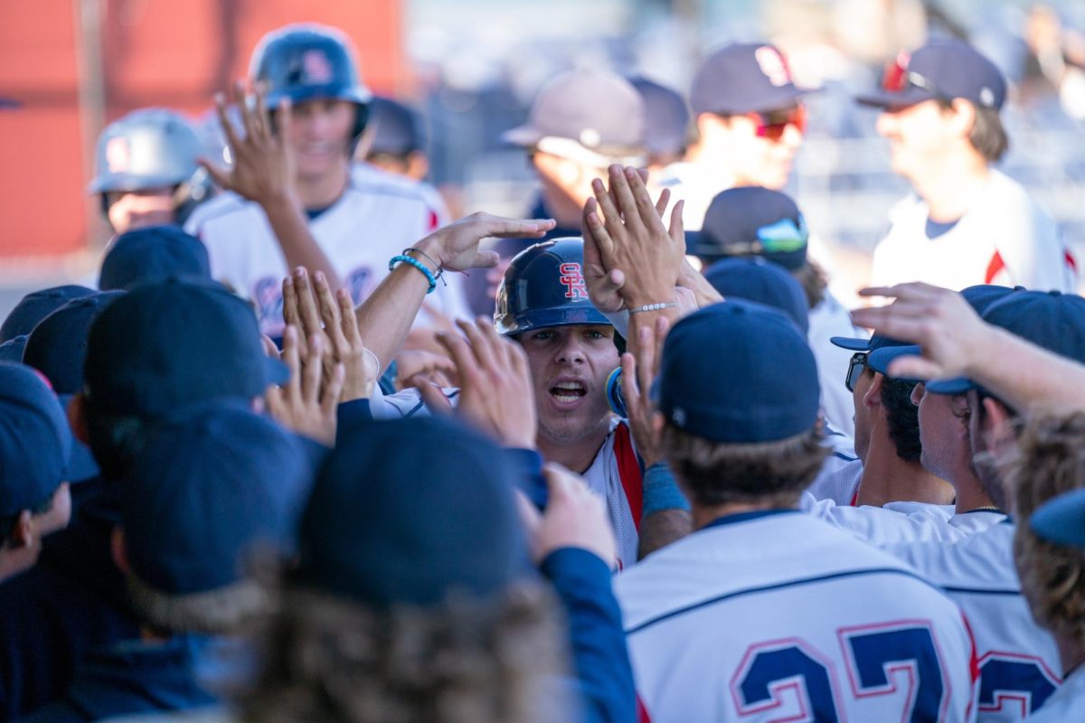 Bear Cubs catcher Mason Cox celebrates with his teammates after scoring due to a throwing error by West Valley pitcher Julian Ito on Tuesday, Jan. 28, 2025 in Santa Rosa.