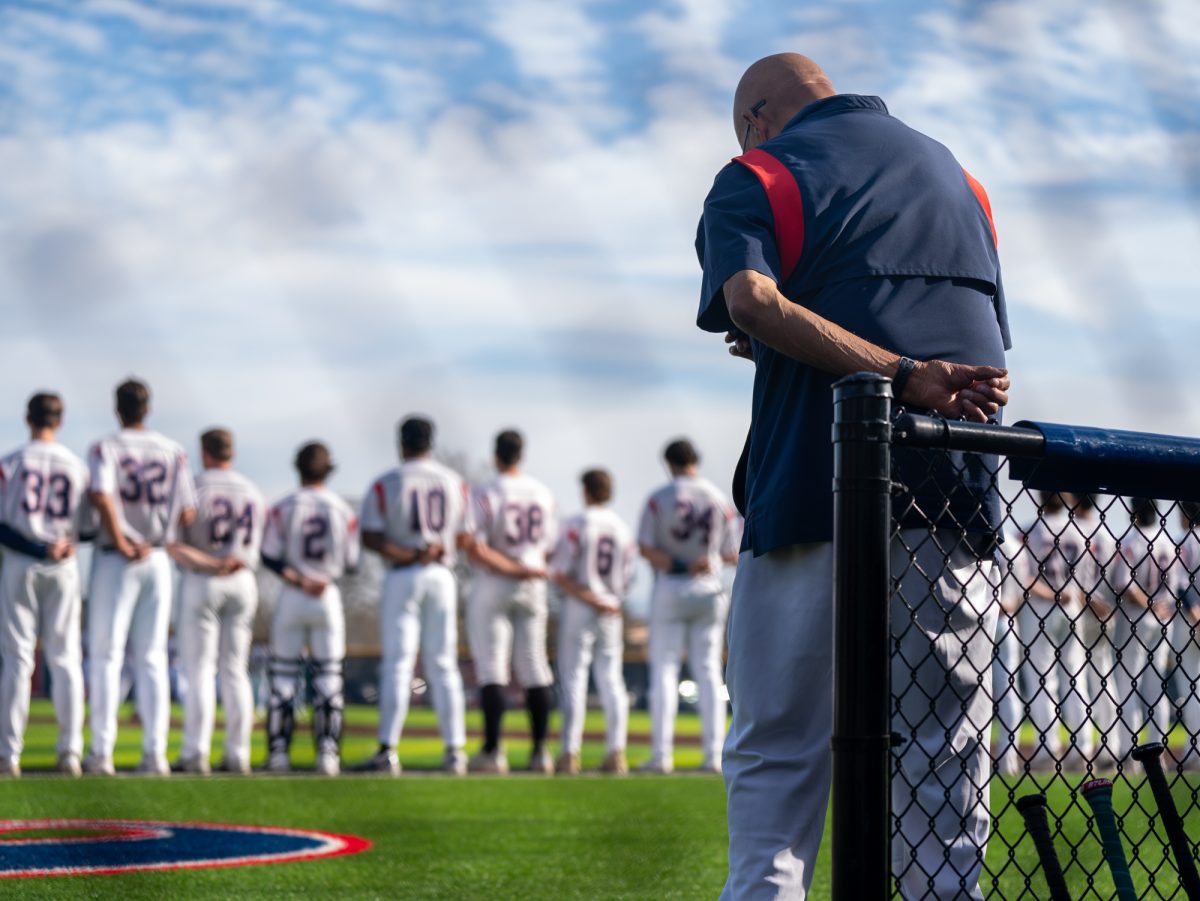 Bear Cubs assistant coach Tom Francois bows his head for the national anthem at home against Chabot on Friday, Jan. 24th, 2025