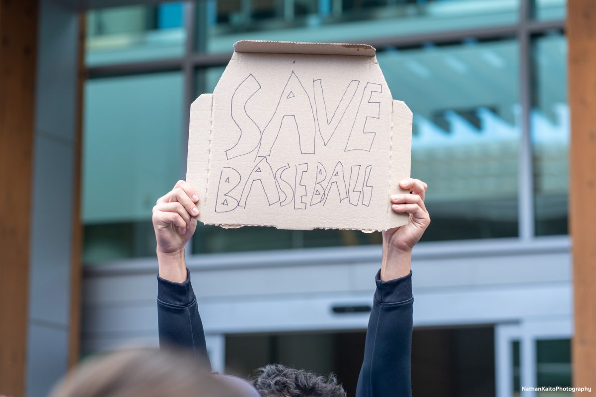 Sonoma State University's baseball team holds up a sign, in protest of the budget cuts in Rohnert Park on Thursday, Jan. 30, 2025