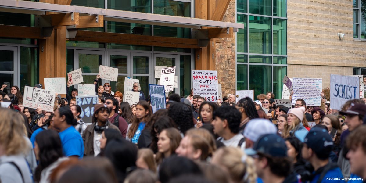 Sonoma State University students comes out in the masses with signs to protest the budget cuts in Rohnert Park on Thursday, Jan. 30, 2025.