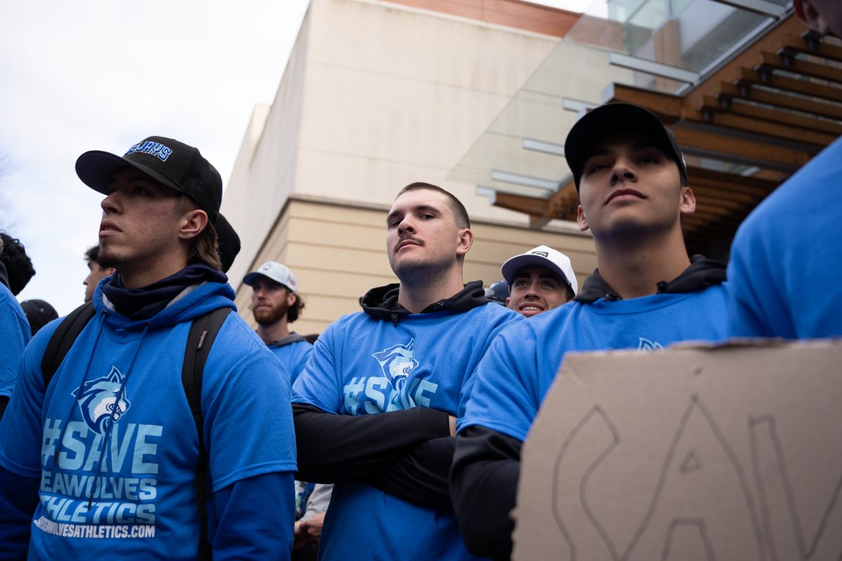 Sonoma State University baseball player Dominick Lombardi stands with his teamates in protest of Sonoma State University's budget cuts in Rohnert Park on Thursday, Jan. 30, 2025.