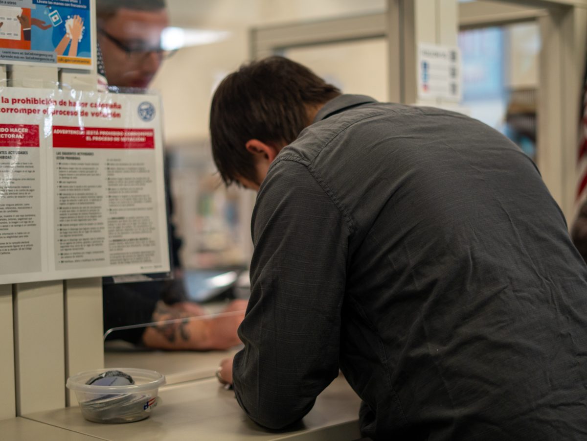 The voter finishes registering to vote at the Registrar of Voters in Santa Rosa on Tuesday, Nov. 5, 2024.