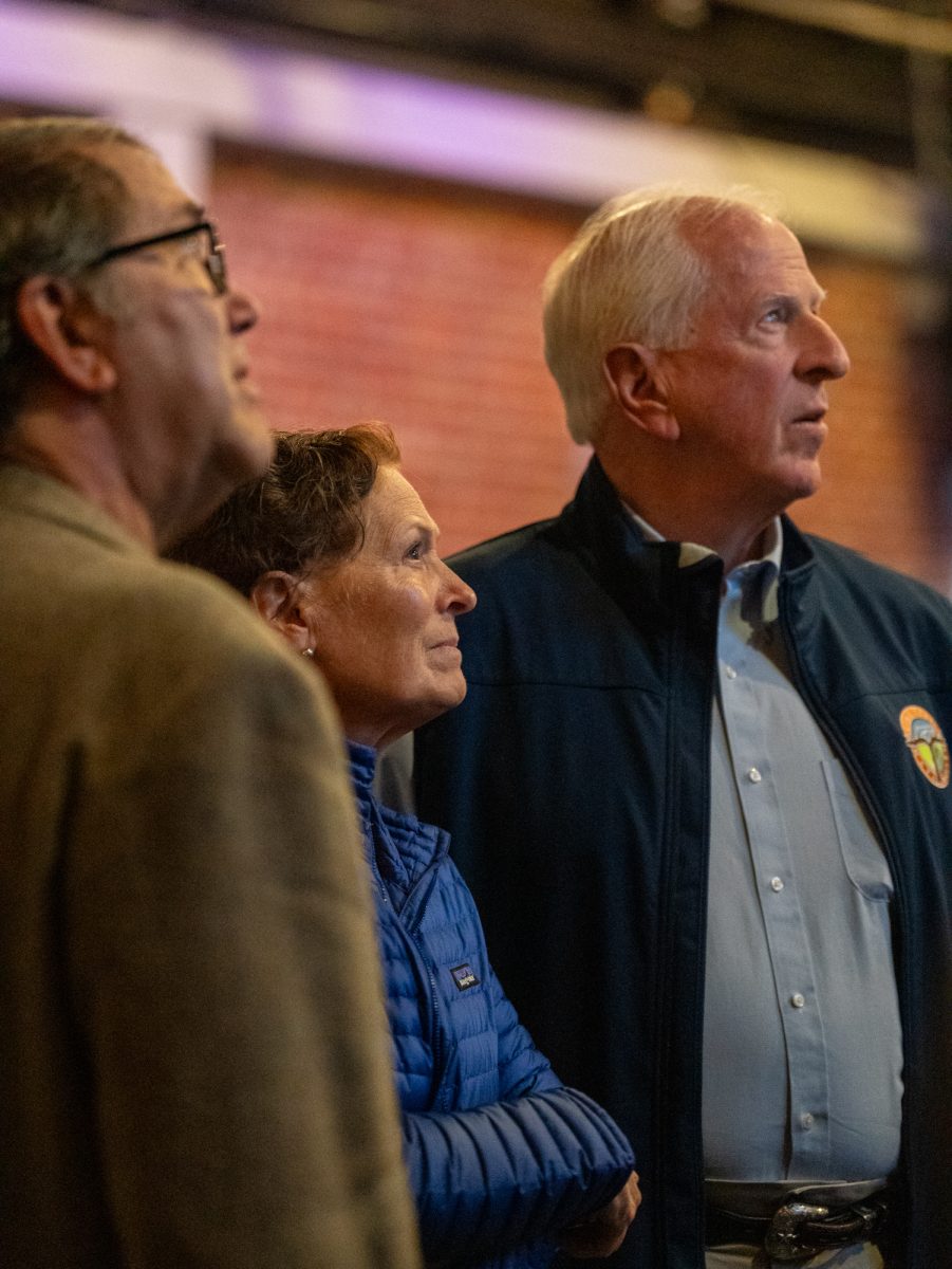 Representative Mike Thompson, right, looks on as more election results are projected on television at the Democratic watch party at Barrelproof Lounge in Santa Rosa on Tuesday, Nov. 5, 2024.