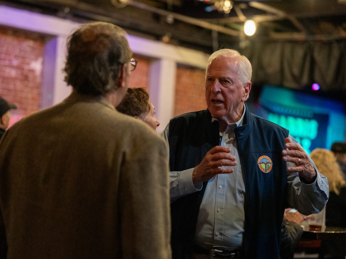 Mike Thompson engages in animated conversation at the Democratic watch party at Barrelproof Lounge in Santa Rosa on Tuesday, Nov. 5, 2024.