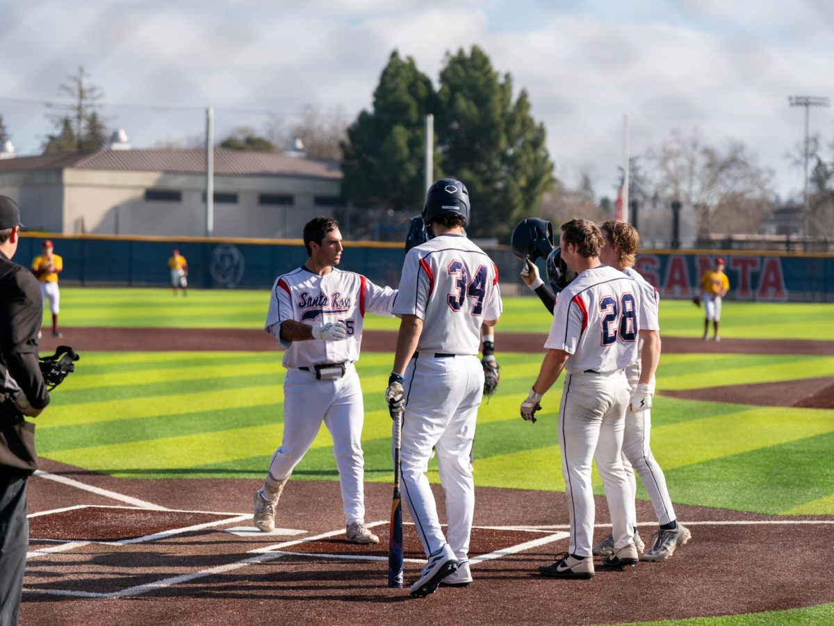 Josh Martin is greeted at home plate after a home run during the scrimmage against Sacramento City College on Jan. 17, 2025.