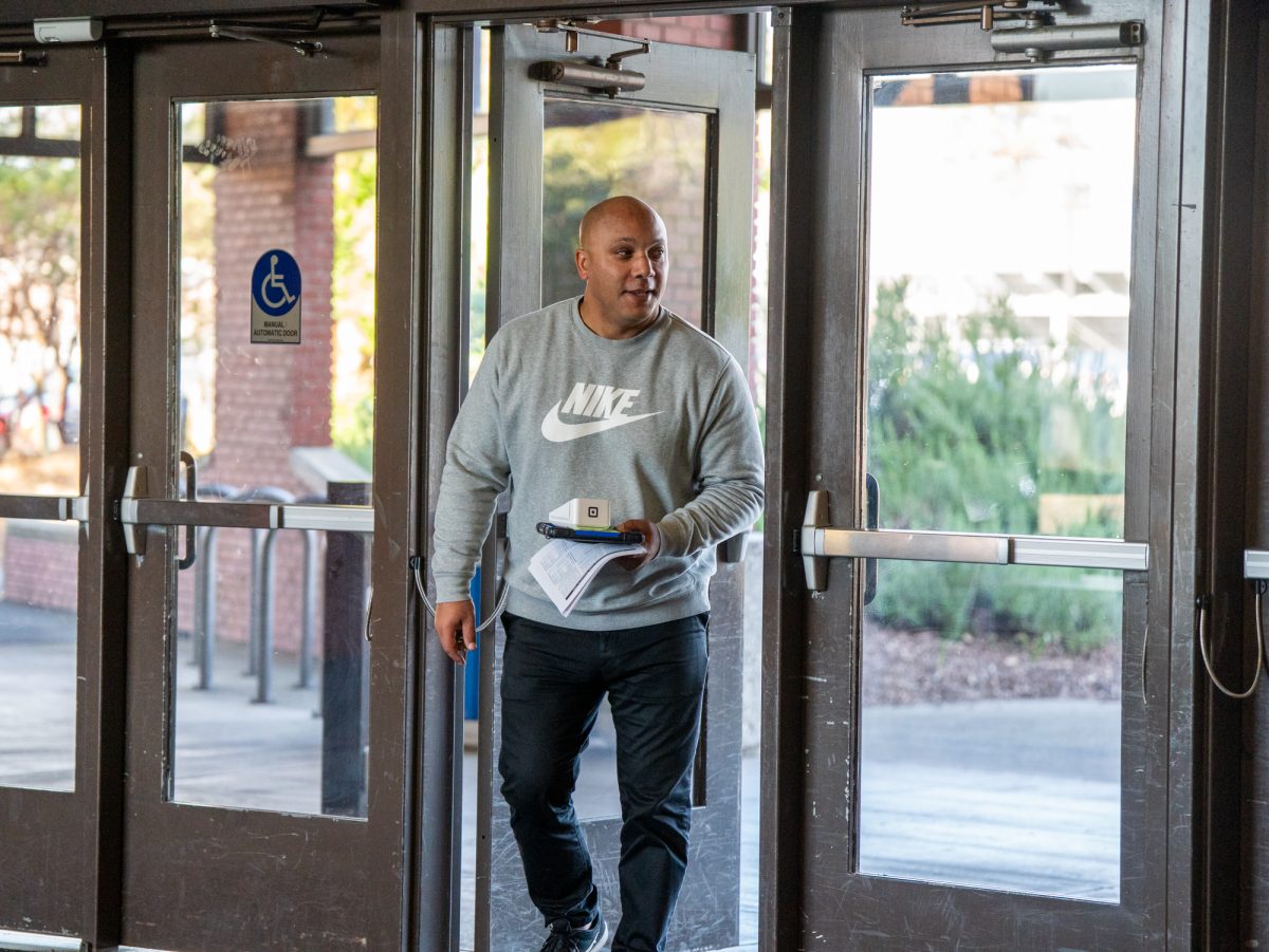 Assistant athletic director Nick Hill arrives at Haehl Pavilion ahead of the game against American River on Friday, Feb. 21, 2025.