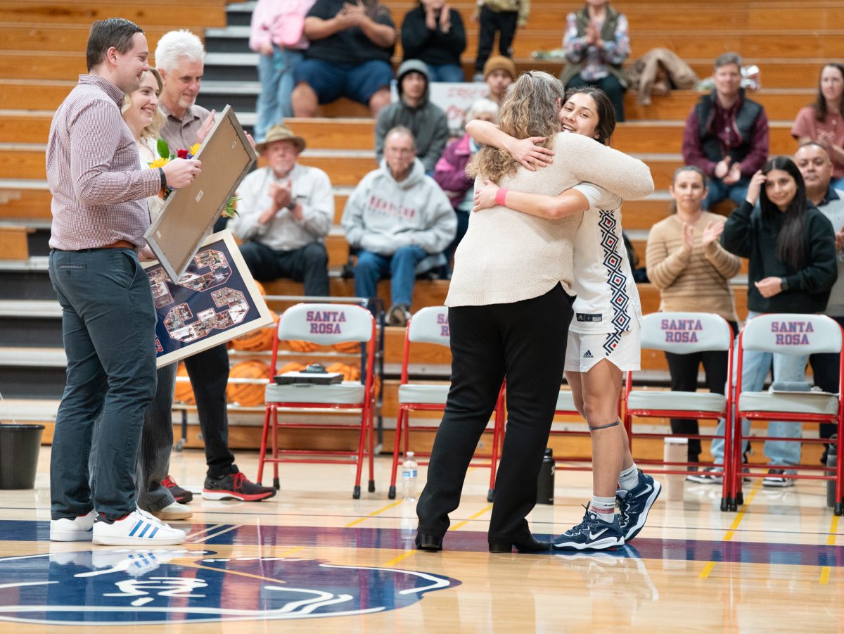 Sophomore guard Lindsey Arellano shares a moment with head coach Lacey Campbell on sophomore night ahead of the game against American River at home on Friday, Feb. 21, 2025.