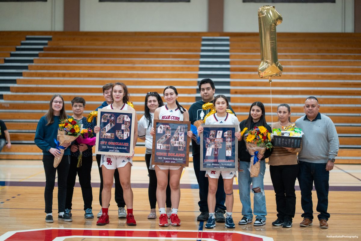 The Bear Cubs' sophomores poses with thier friends and families infront of the home support as they get recognized for their time playing at SRJC before their game against American River on Friday, Feb. 21, 2025.