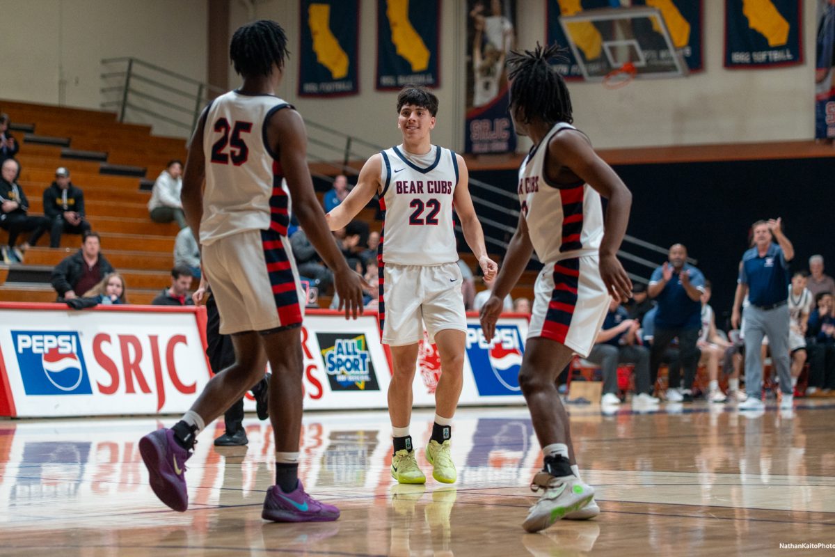 Bear Cubs' guard Andrew Pengel goes to celebrate with guards, Gavin Cook-Whisenton and Yanik Anderson during a strong start against American River at Haehl Pavilion on Friday, Feb. 21, 2025.