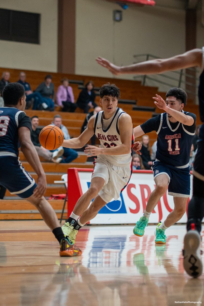 SRJC's guard Andrew Pengel bursts past mulitple American River defenders as he tries to the rim at Haehl Pavilion on Friday, Feb. 21, 2025.