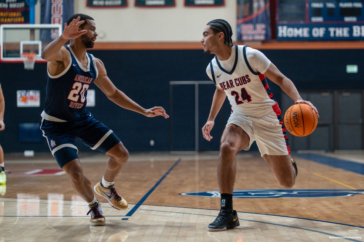 Bear Cubs' forward Vincent Jackson sizes up American River's forward Martin Billings during the early exchanges at Haehl Pavilion on Friday, Feb. 21, 2025.