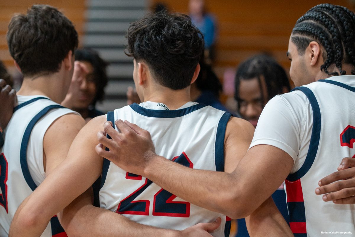 Bear Cubs' guard Andrew Pengel and the rest of the team huddles together prior to the game against American River at Haehl Pavilion on Friday, Feb. 21, 2025.