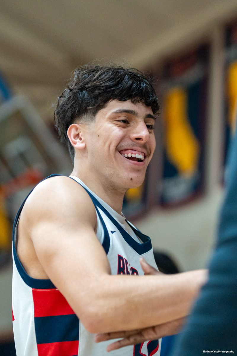 SRJC's guard Andrew Pengel walks out and does a handshake with forward, Dave Baraka as his name echoes around Haehl Pavilion on Friday, Feb. 21, 2025.