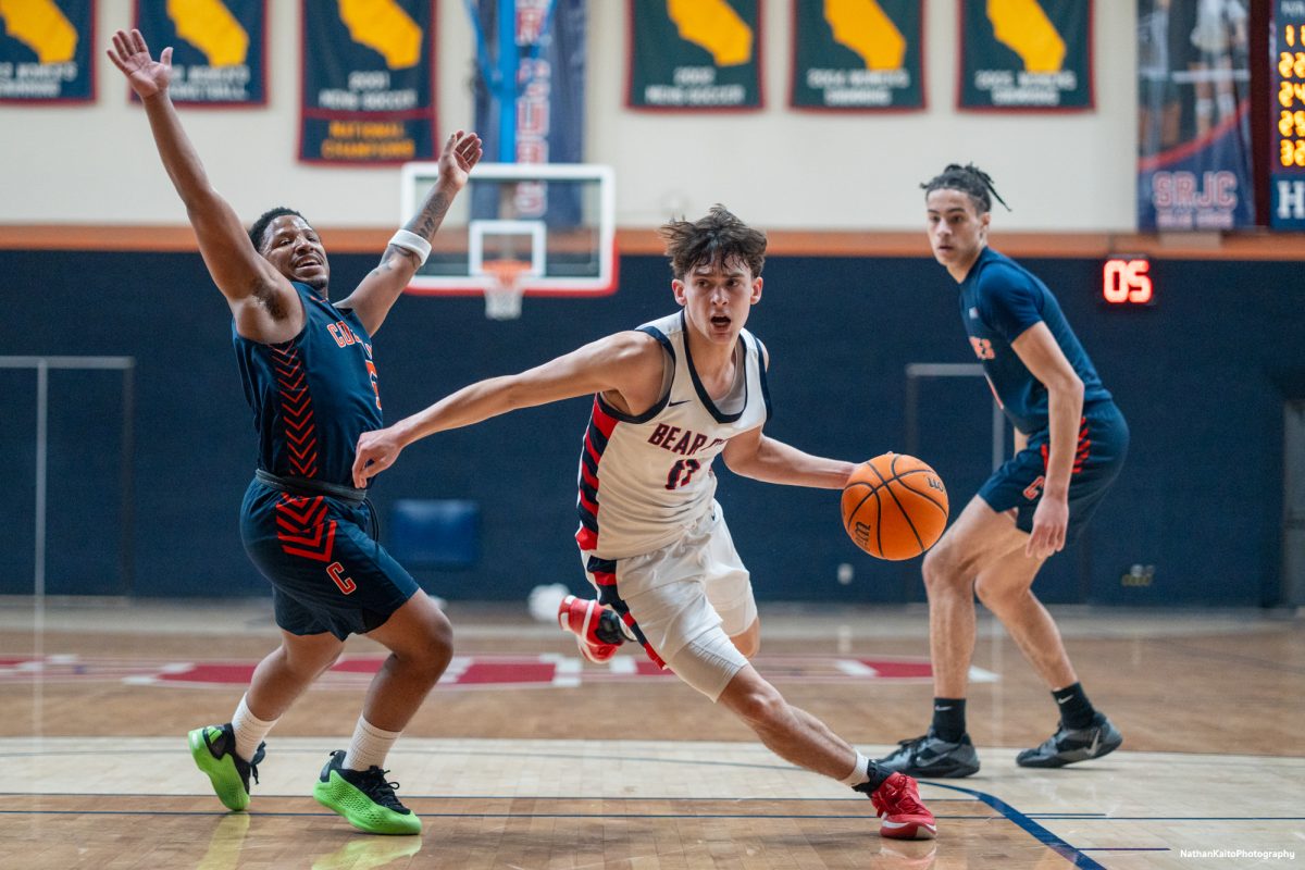 Bear Cubs guard Spencer Langowski bursts past Hawks guard Devon Hayes at Haehl Pavilion on Friday, Feb. 7, 2025.