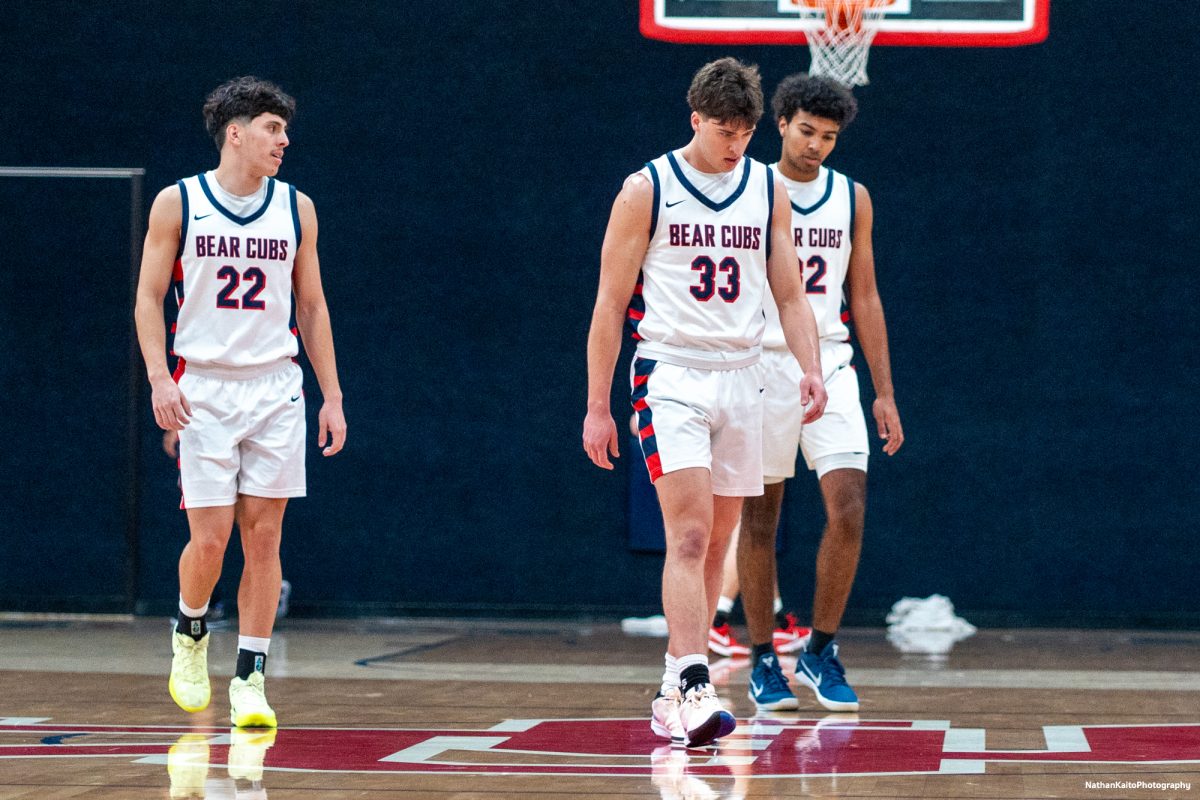 Bear Cubs guard, Andrew Pengel, left, and forwards Audon Forgus, center, and Jaden Washington, right, re-enter the court following a grueling first half against Cosumnes River at Haehl Pavilion on Friday, Feb. 7, 2025.