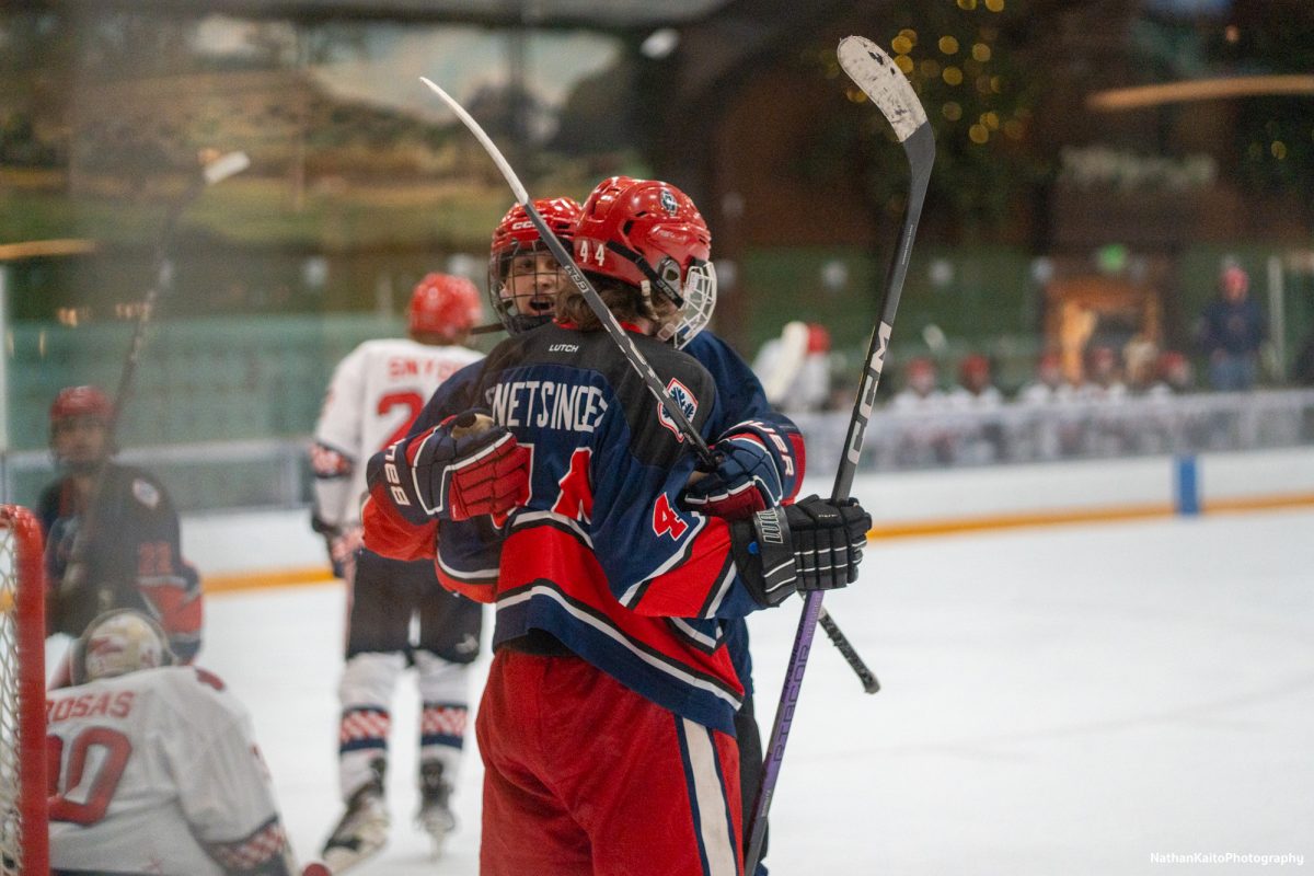 Santa Rosa's forward Grant Snetsinger is embraced after scoring against Fresno at Snoopy's Home Ice on Saturday, Feb. 1, 2025.