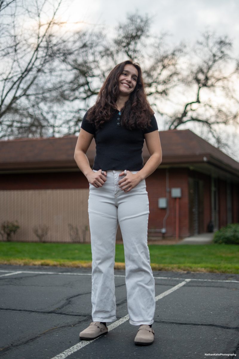 SRJC's guard Ivy Gonzalez poses and smiles as her portrait gets taken outside of Polly O'Meara Hall on Monday, Feb. 24, 2025.