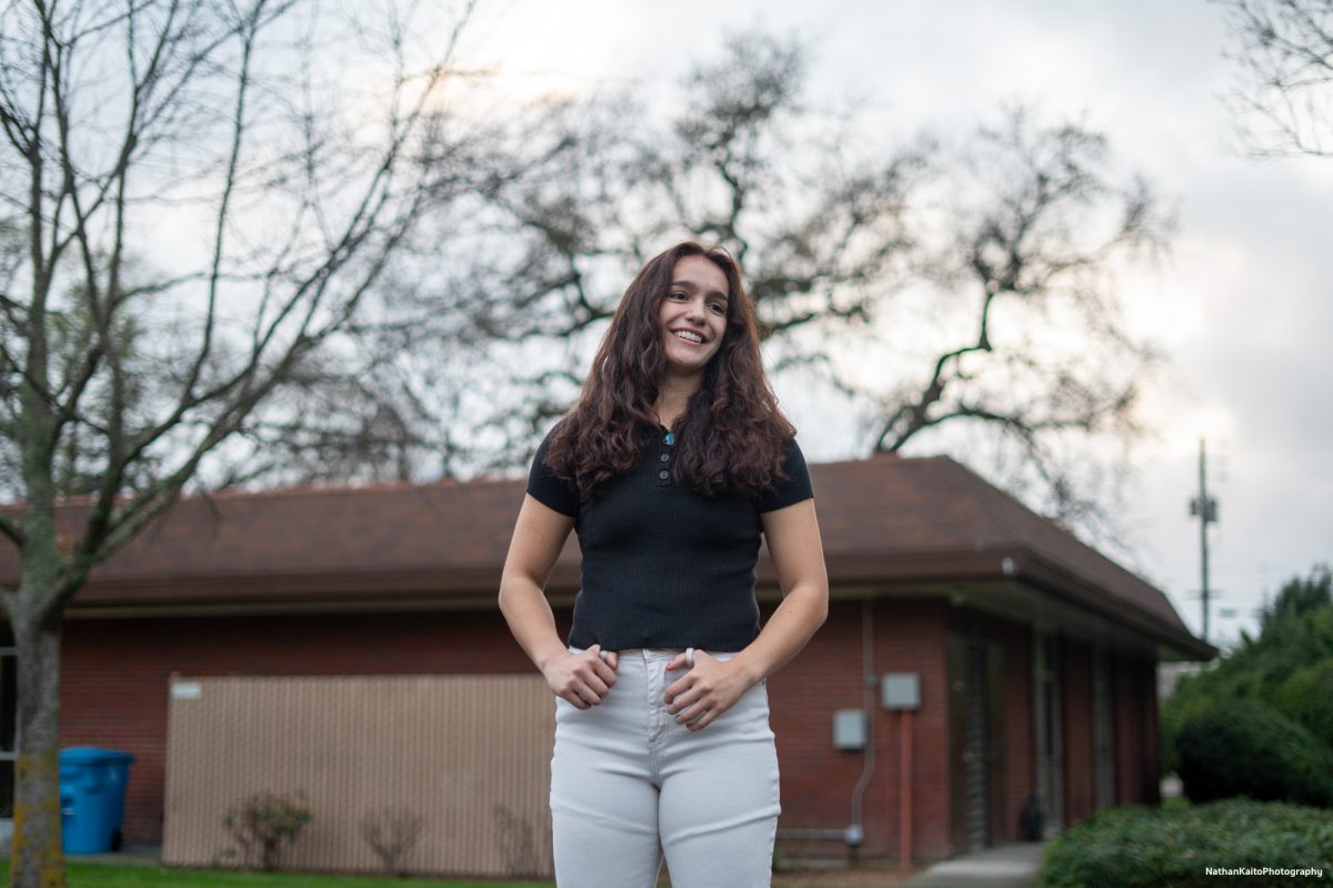 SRJC's sophomore guard Ivy Gonzalez smiles brightly as she poses for a portrait outside of Polly O'Meara Hall on Monday, Feb. 24, 2025.