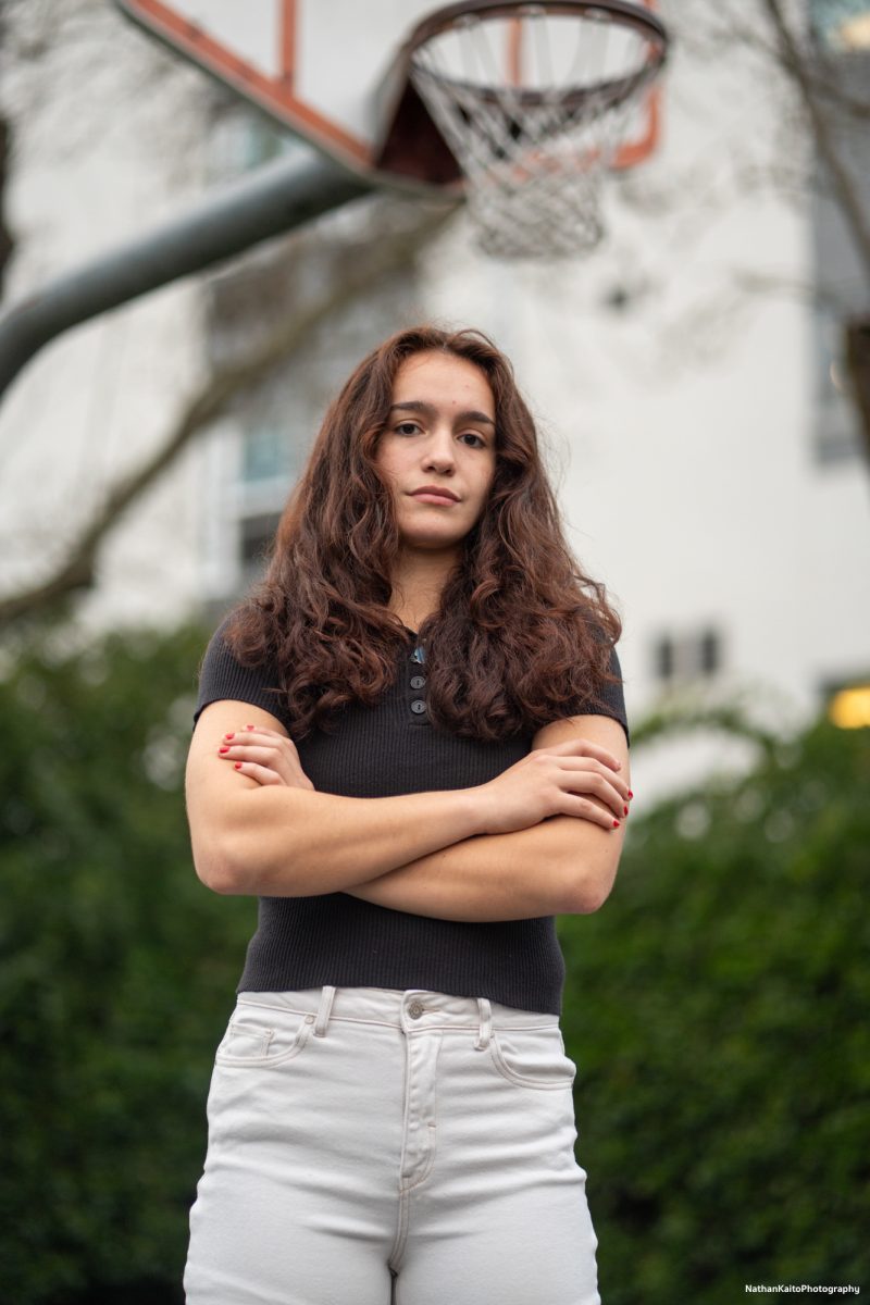 Bear Cubs' guard Ivy Gonzalez poses seriously on the basketball court outside of Polly O'Meara Hall on Monday, Feb. 24, 2025.