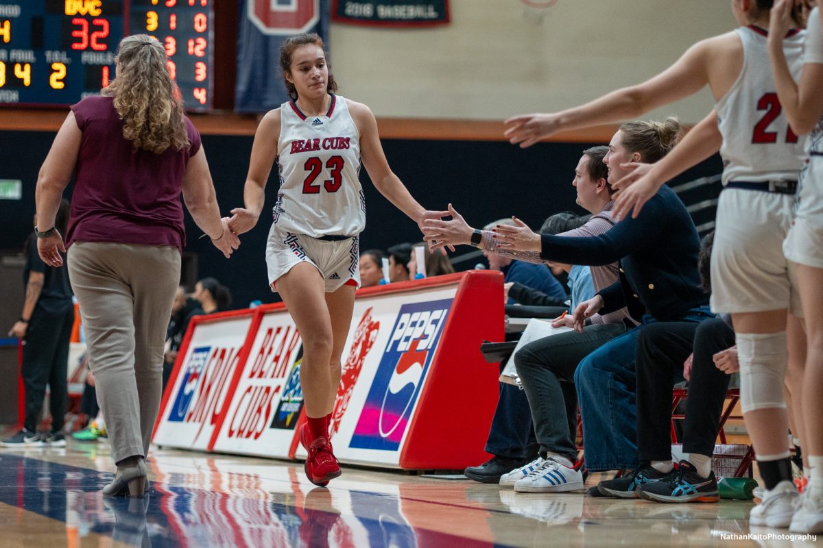 Santa Rosa's guard Ivy Gonzalez high-fives the coaching staff as she makes her way to the bench after a dazzling performance against Diablo Valley at Haehl Pavilion on Jan. 4, 2025.