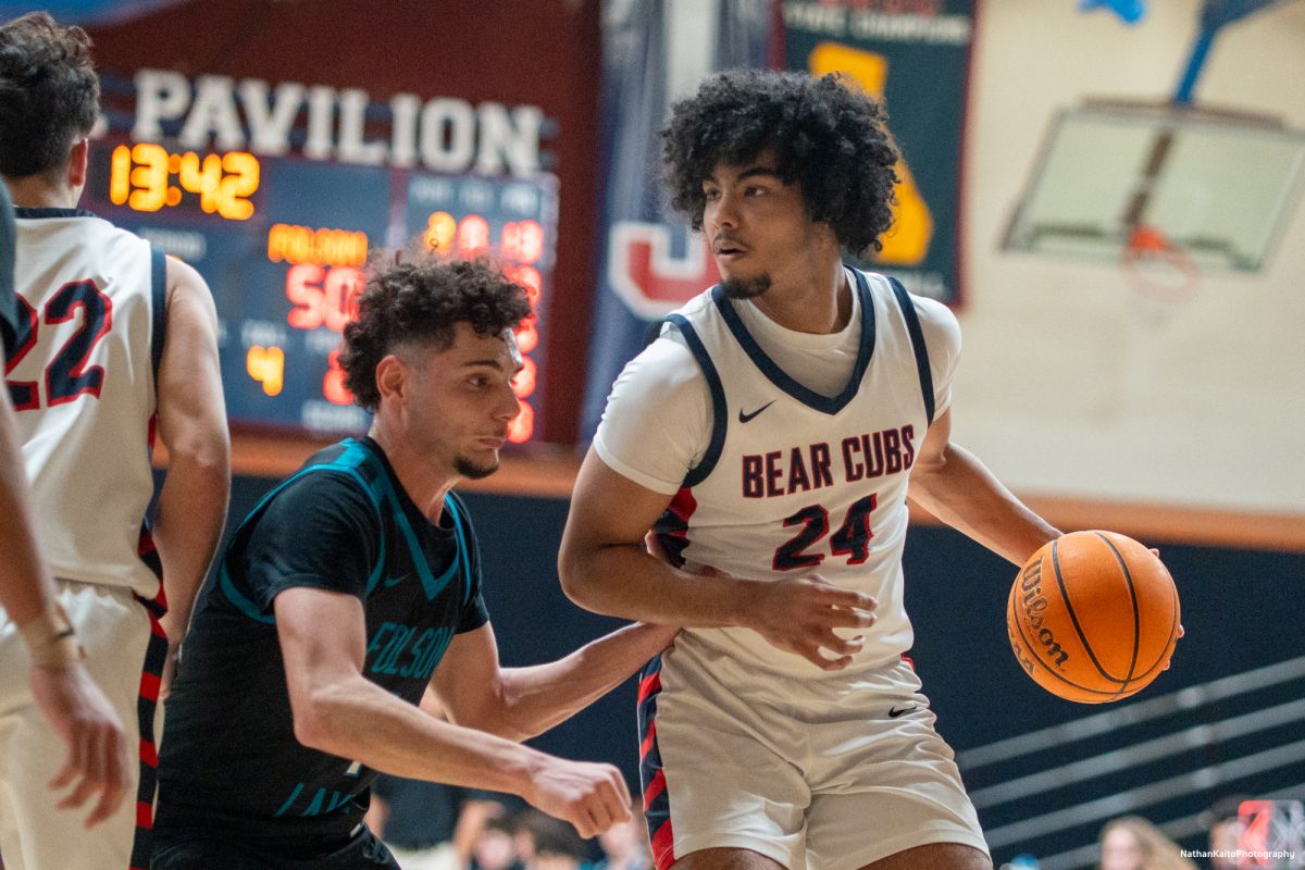 Bear Cubs' forward Vincent Jackson looks to pass the ball while Pengel sets a screen against Folsom Lake at Haehl Pavilion on Friday, Feb. 14, 2025. 