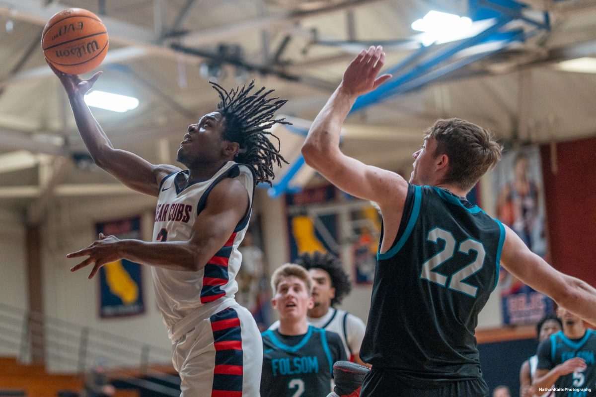 Bear Cubs' guard Yanik Anderson burst past the Hawk's Miko Bear for a layup at Haehl Pavilion on Friday, Feb. 14, 2025. 