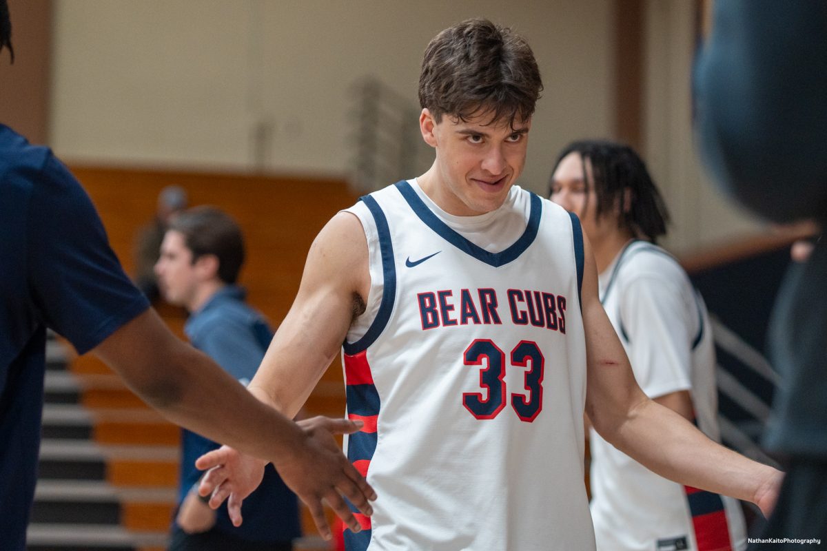 Bear Cubs' forward Audon Forgus enters the court as his name rings around Haehl Pavilion before the game against Folsom Lake on Friday, Feb. 14, 2025. 