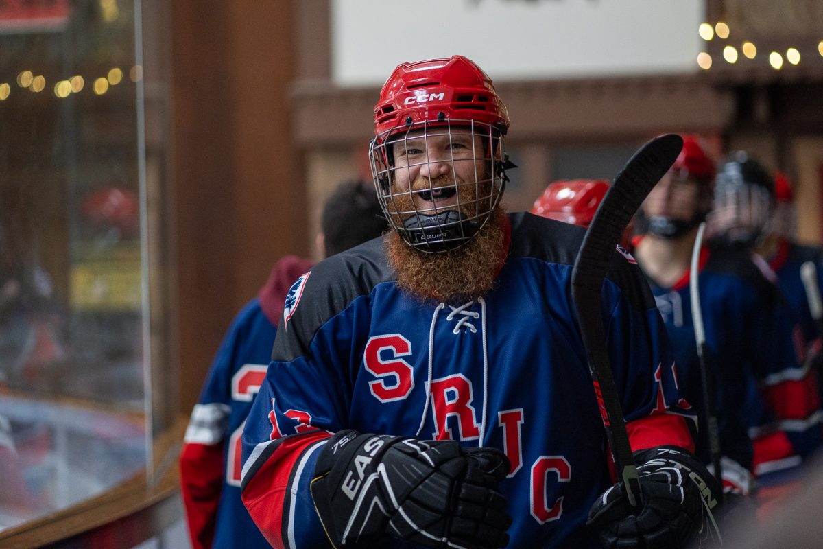 Polar Bears forward Jon Christenson is all smiles before making his way back into the rink at Snoopy's Home Ice on Saturday, Feb. 1, 2025.