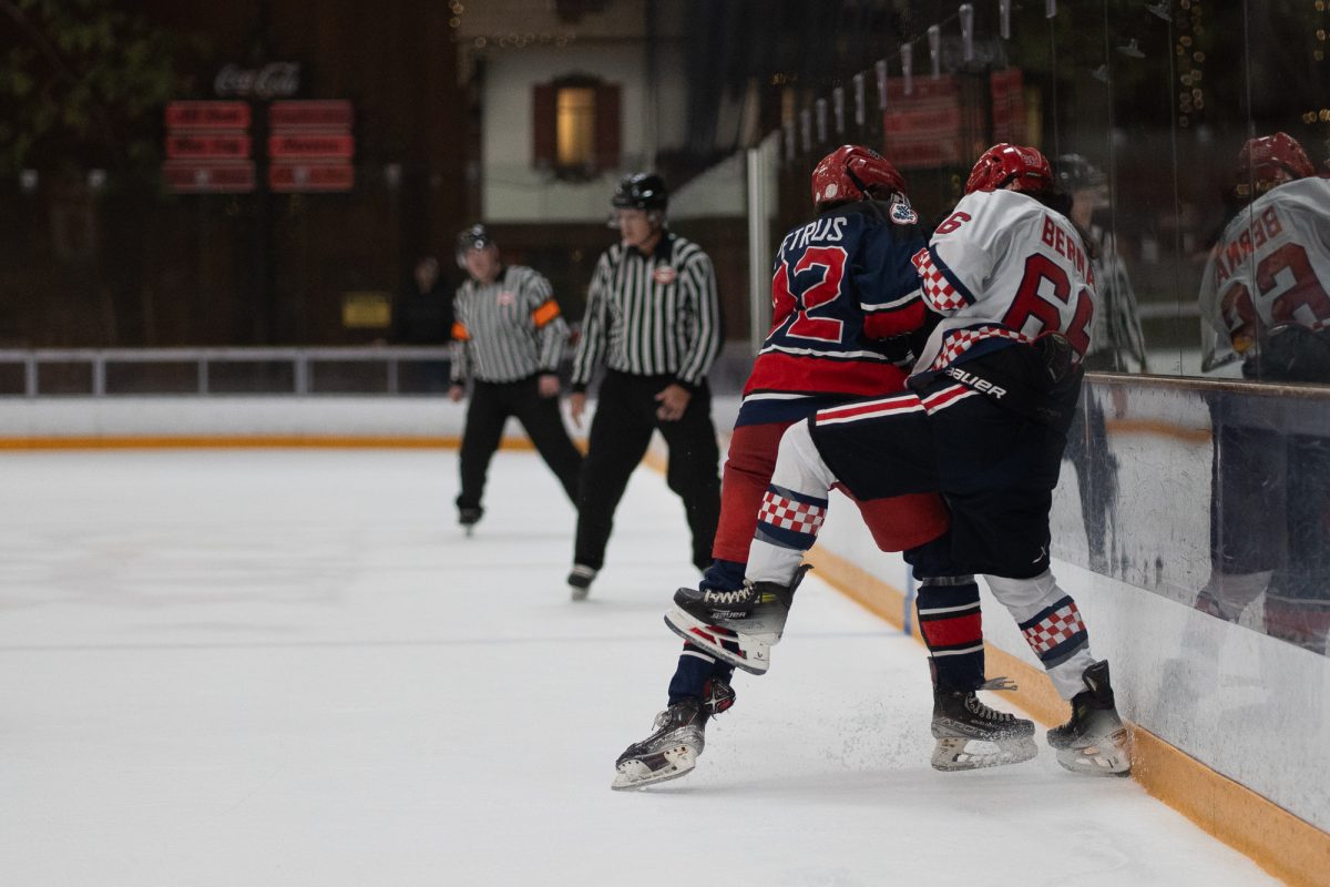 Santa Rosa forward/defense Jonah Petrus checks a Fresno State defender at Snoopy's Home Ice on Saturday, Feb. 1, 2025.