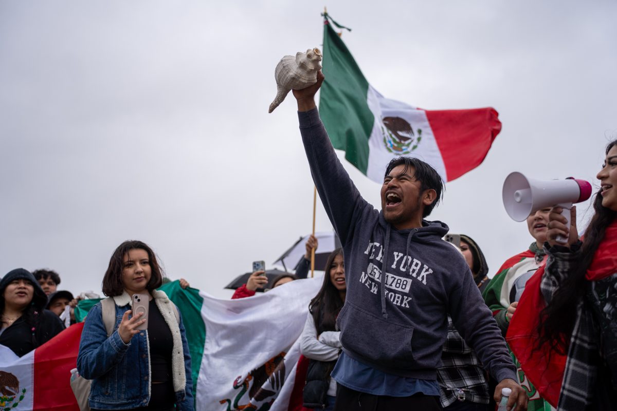 A mob of protesters make one final collective chant in protest of the crackdown on immigration outside of Mitote Food Park on Monday, Feb. 3, 2025.