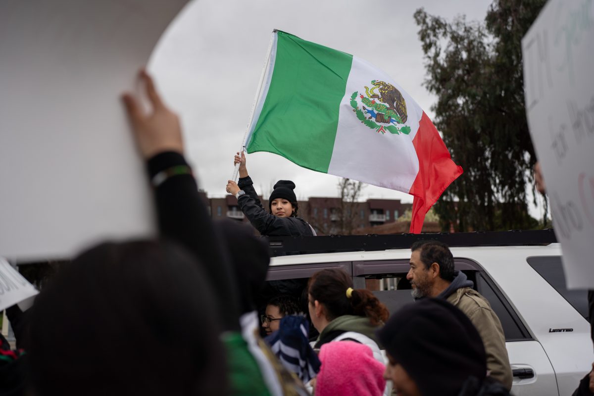 Picketers march down Railroad Street in protest of immigration crackdowns on Monday, Feb. 3, 2025.