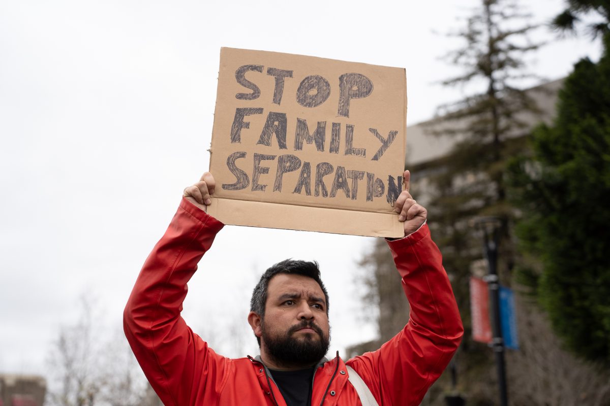 Sergio P. protests the crackdown on immigration at Old Courthouse Square on Monday, Feb. 3, 2025