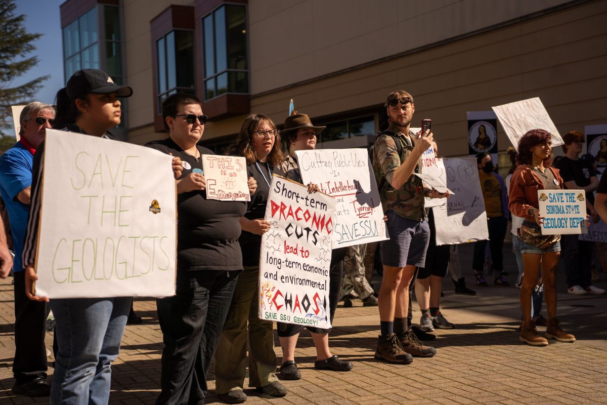 Sonoma State University students picket in Seawolf Plaza before the state legislative forum at Sonoma State University on Friday, Feb. 21, 2025.