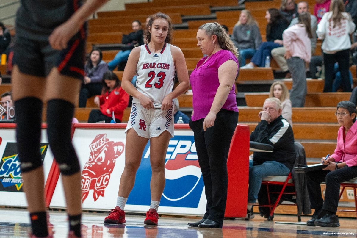 Bear Cubs guard Ivy Gonzalez recieves instructions from head coach Lacey Campbell while Cosumnes River takes free throws at Haehl Pavilion on Friday, Feb. 7, 2025.