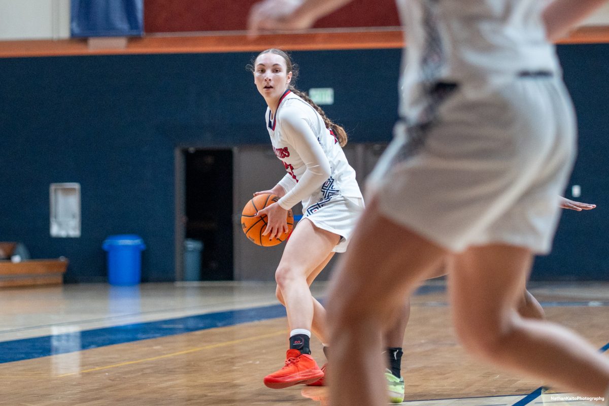 Bear Cubs guard Caitlin Baldwin shields the ball and looks to pass Cosumnes River at Haehl Pavilion on Friday, Feb. 7, 2025.