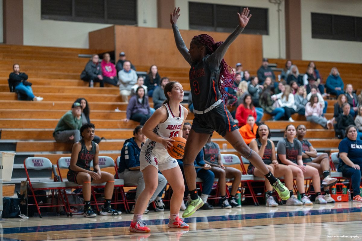 Bear Cubs guard Shasta Vlasak pump fakes Hawks guard LaKayla Hale during the opening exchanges against Cosumnes River at Haehl Pavilion on Friday, Feb. 7, 2025