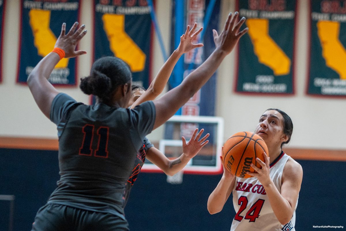 Bear Cubs forward Cece Solano drives against Cosumnes River defenders on Friday, Feb. 7, 2025