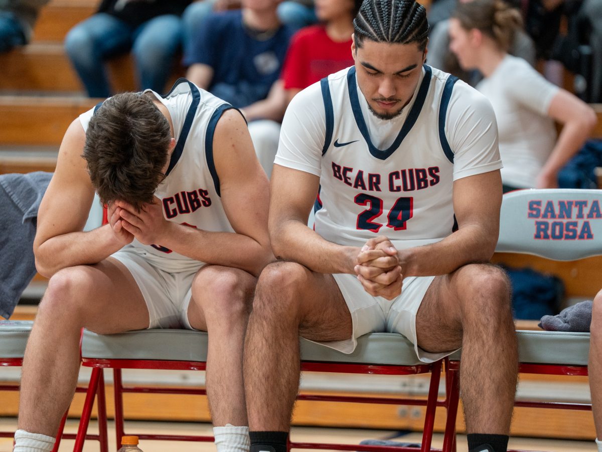 From left to right: Bear Cub guard Spencer Langowski and forward Vincent Jackson take a moment of silence ahead of the game against American River at home on Friday, Feb. 21, 2025.