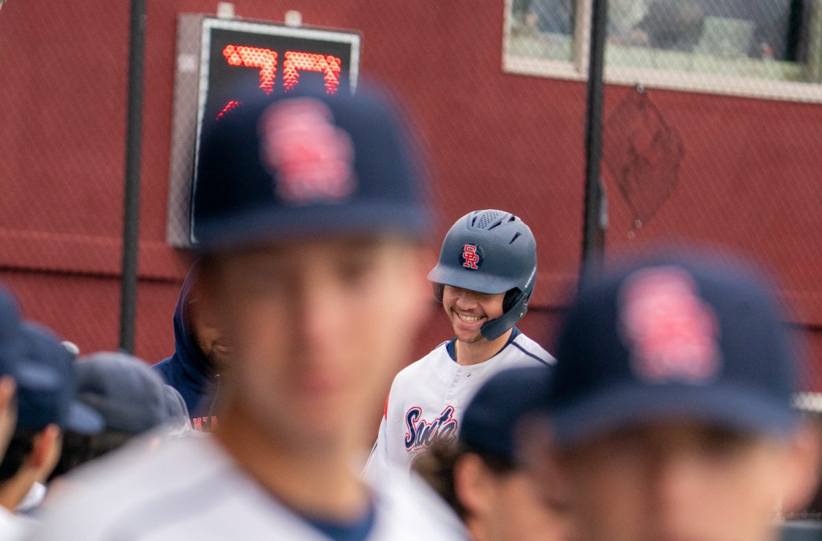 Freshman designated hitter J.T. Summers is all smiles as he returns to the dugout during the scrimmage against Sacramento City College at home, Jan. 17, 2025.