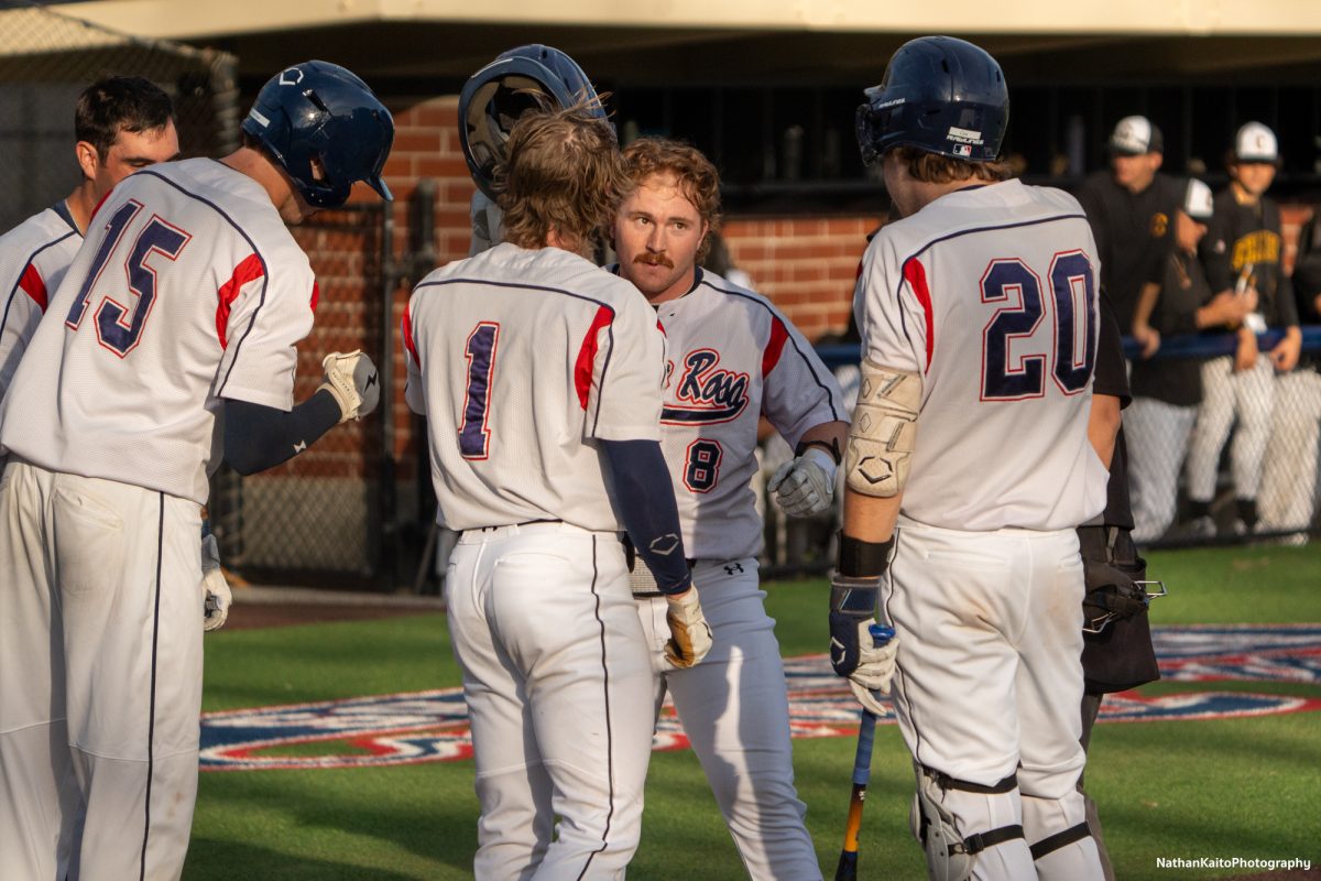 Bear Cubs' infielder Joe Brown takes off his helmet to celebrate a home-run with his teammates against West Valley on Jan. 28, 2025. 